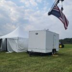 15_ with tents and flag