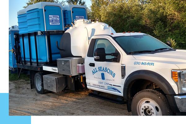 All Seasons truck and portables on the of a back tow bed